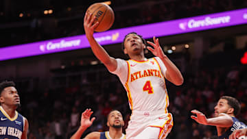 Dec 2, 2024; Atlanta, Georgia, USA; Atlanta Hawks guard Kobe Bufkin (4) shoots against the New Orleans Pelicans in the second quarter at State Farm Arena. Mandatory Credit: Brett Davis-Imagn Images