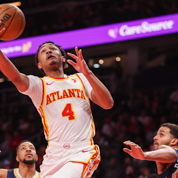 Dec 2, 2024; Atlanta, Georgia, USA; Atlanta Hawks guard Kobe Bufkin (4) shoots against the New Orleans Pelicans in the second quarter at State Farm Arena. Mandatory Credit: Brett Davis-Imagn Images