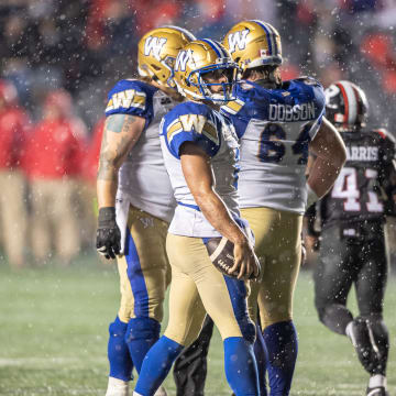 Jun 13, 2024; Ottawa, Ontario, CAN; Winnipeg Blue Bombers quarterback Zach Collards (8) looks on after a failed drive at the end of the second half against the Ottawa REDBLACKS at TD Place. Mandatory Credit: Marc DesRosiers-USA TODAY Sports