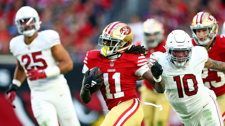 Dec 17, 2023; Glendale, Arizona, USA; San Francisco 49ers wide receiver Brandon Aiyuk (11) runs the ball against San Francisco 49ers wide receiver Ronnie Bell (10) during the second half at State Farm Stadium. Mandatory Credit: Mark J. Rebilas-USA TODAY Sports