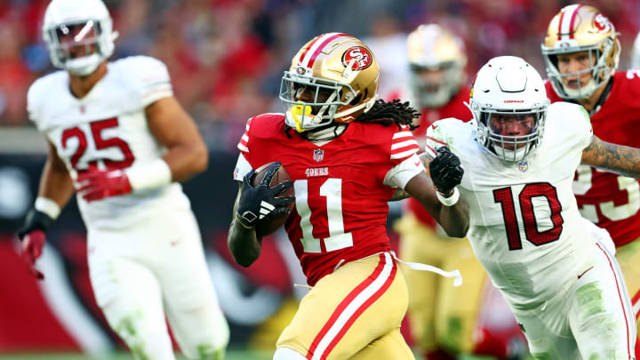 Dec 17, 2023; Glendale, Arizona, USA; San Francisco 49ers wide receiver Brandon Aiyuk (11) runs the ball against San Francisco 49ers wide receiver Ronnie Bell (10) during the second half at State Farm Stadium. Mandatory Credit: Mark J. Rebilas-USA TODAY Sports