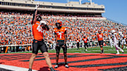 Oklahoma State's Josh Ford (40) celebrates a touchdown next to Oklahoma State's Shamar Rigby (7) in the first half of the college football game between the Oklahoma State Cowboys and the Baylor Bears at Boone Pickens Stadium in Stillwater, Okla., Saturday, Sept. 27, 2025.