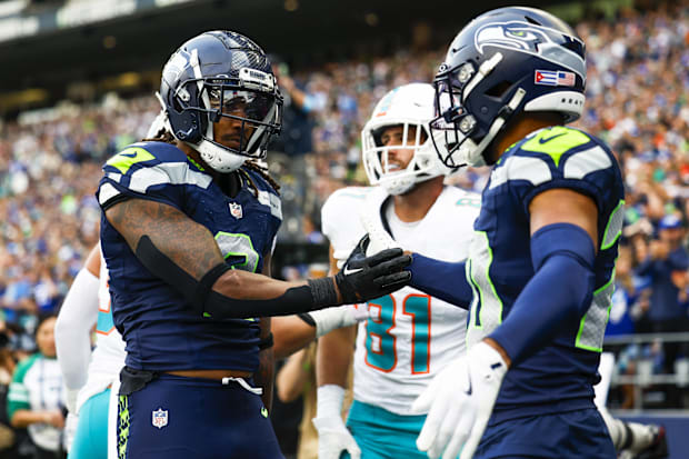 Seattle Seahawks safety Rayshawn Jenkins (2) celebrates with safety Julian Love (20) an incomplete pass.