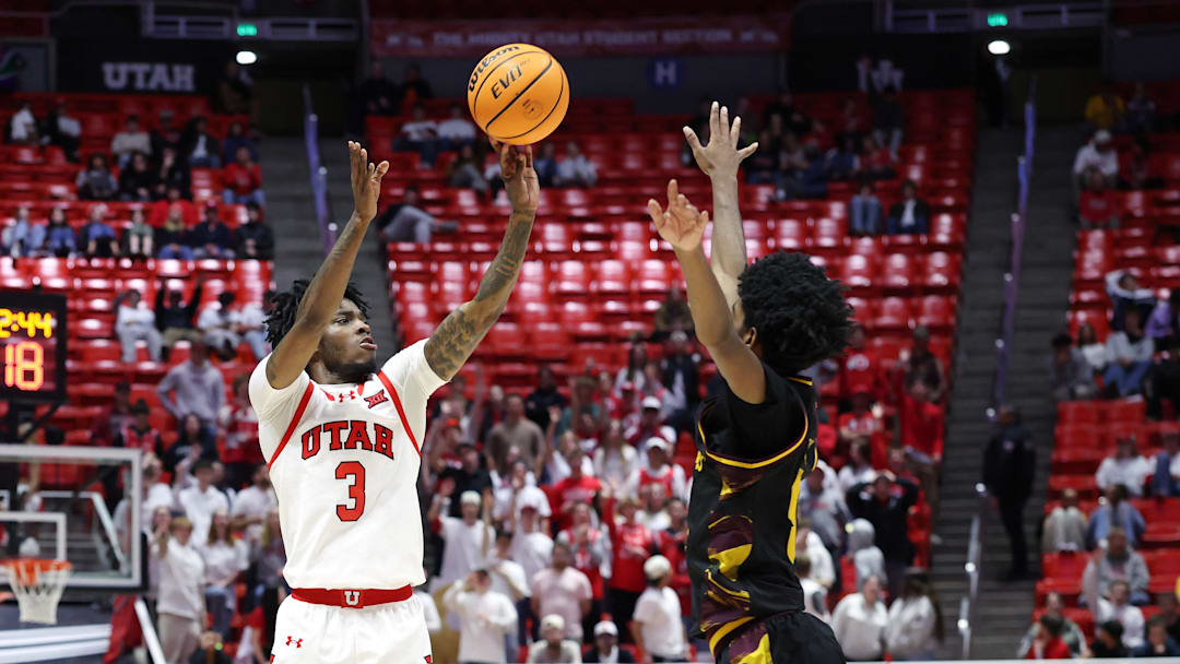 Feb 4, 2026; Salt Lake City, Utah, USA; Utah Utes guard Don McHenry (3) takes a three point shot as Arizona State Sun Devils guard Maurice Odum (5) defends during the second half at Jon M. Huntsman Center. Mandatory Credit: Rob Gray-Imagn Images