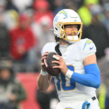 Dec 3, 2023; Foxborough, Massachusetts, USA; Los Angeles Chargers quarterback Justin Herbert (10) looks to throw against the New England Patriots during the first half at Gillette Stadium. Mandatory Credit: Brian Fluharty-Imagn Images