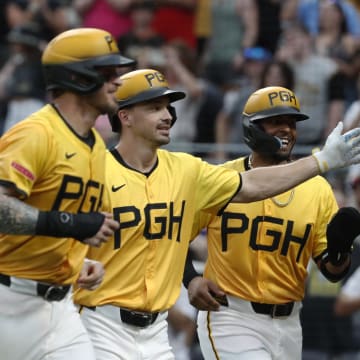Pittsburgh Pirates designated hitter Bryan Reynolds (middle) celebrates his grand slam home run with catcher Yasmani Grandal (left) and right fielder Joshua Palacios (right) center) and shortstop Oneil Cruz (right) against the New York Mets during the seventh inning at PNC Park on July 5.
