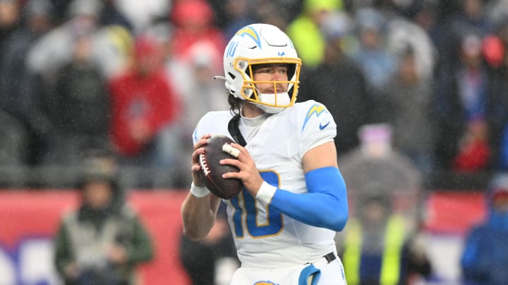 Dec 3, 2023; Foxborough, Massachusetts, USA; Los Angeles Chargers quarterback Justin Herbert (10) looks to throw against the New England Patriots during the first half at Gillette Stadium. Mandatory Credit: Brian Fluharty-USA TODAY Sports