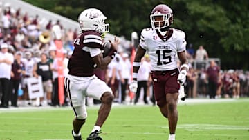 Aug 31, 2024; Starkville, Mississippi, USA; Mississippi State Bulldogs wide receiver Mario Craver (7) makes a reception against Eastern Kentucky Colonels defensive back Garnell Wilds Jr. (15) during a play that would result in a touchdown in the second quarter at Davis Wade Stadium at Scott Field. Mandatory Credit: Matt Bush-Imagn Images