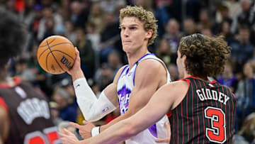 Nov 16, 2025; Salt Lake City, Utah, USA; Utah Jazz forward/center Lauri Markkanen (23) makes a pass around Chicago Bulls guard Josh Giddey (3) during the first half at Delta Center. Mandatory Credit: Peter Creveling-Imagn Images