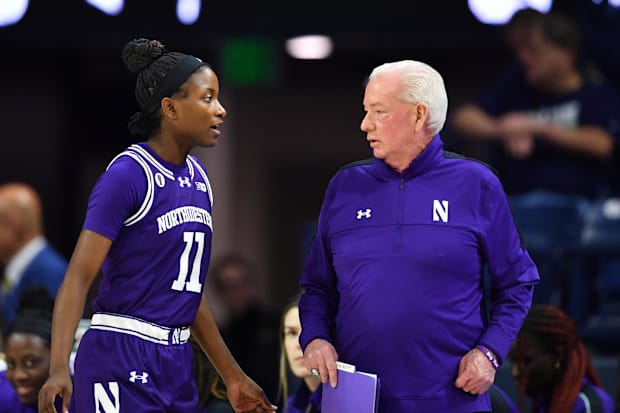 Northwestern Wildcats head coach Joe McKeown talks to guard Hailey Weaver (11) in the first half against Notre Dame.