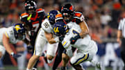 Oregon State's Nikko Taylor tackles California's Kendrick Raphael during an NCAA football game against California at Reser Stadium on Saturday, Aug. 30, 2025, in Corvallis, Ore.