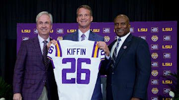 Dec 1, 2025; Baton Rouge, LA, USA; LSU president Wade Rousse, left, LSU new head coach Lane Kiffin and LSU athletic director Verge Ausberry stand together at South Stadium Club at Tiger Stadium. Mandatory Credit: Matthew Hinton-Imagn Images