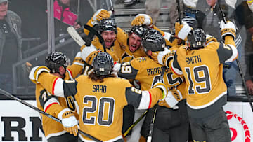 Apr 29, 2025; Las Vegas, Nevada, USA; Vegas Golden Knights center Brett Howden (21) celebrates with team mates after scoring a game-winning goal in overtime to give the Vegas Golden Knights a 3-2 victory over the Minnesota Wild in game five of the first round of the 2025 Stanley Cup Playoffs at T-Mobile Arena. Mandatory Credit: Stephen R. Sylvanie-Imagn Images