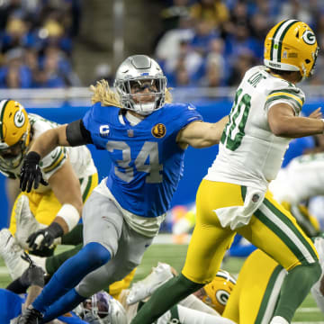 Green Bay Packers QB Jordan Love fires a pass while under pressure from Detroit Lions linebacker Alex Anzalone at Ford Field on Thanksgiving.