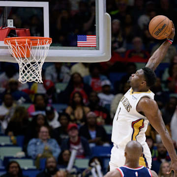 Mar 11, 2025; New Orleans, Louisiana, USA; New Orleans Pelicans forward Zion Williamson (1) dunks against Los Angeles Clippers guard Kris Dunn (8) during the second half at Smoothie King Center. Mandatory Credit: Matthew Hinton-Imagn Images