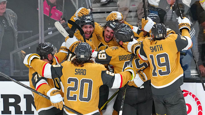 Apr 29, 2025; Las Vegas, Nevada, USA; Vegas Golden Knights center Brett Howden (21) celebrates with team mates after scoring a game-winning goal in overtime to give the Vegas Golden Knights a 3-2 victory over the Minnesota Wild in game five of the first round of the 2025 Stanley Cup Playoffs at T-Mobile Arena. Mandatory Credit: Stephen R. Sylvanie-Imagn Images