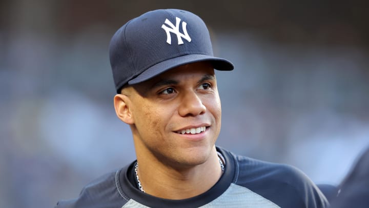 Jun 9, 2024; Bronx, New York, USA; New York Yankees right fielder Juan Soto (22) watches from the dugout during the third inning against the Los Angeles Dodgers at Yankee Stadium. Mandatory Credit: Brad Penner-USA TODAY Sports