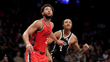 Mar 28, 2025; Brooklyn, New York, USA; Los Angeles Clippers guard Ben Simmons (25) and Brooklyn Nets forward Maxwell Lewis (27) watch a foul shot during the fourth quarter at Barclays Center. Mandatory Credit: Brad Penner-Imagn Images