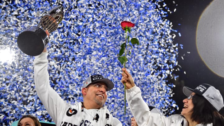 Penn State Nittany Lions head coach James Franklin celebrates with the trophy on the podium after the 2023 Rose Bowl. 