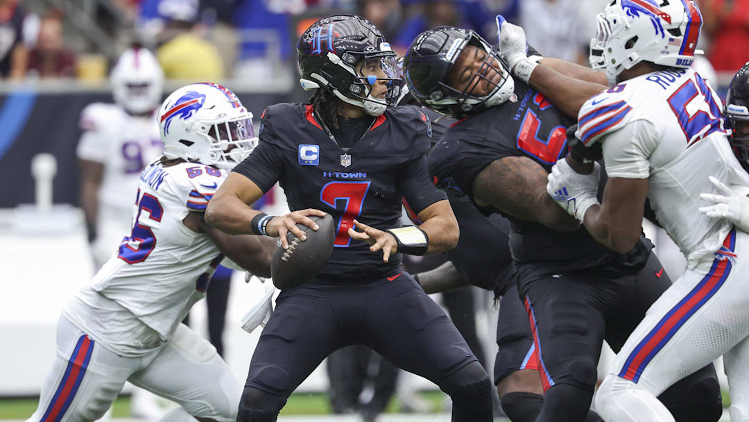 Oct 6, 2024; Houston, Texas, USA; Houston Texans quarterback C.J. Stroud (7) looks for an open receiver during the fourth quarter against the Buffalo Bills at NRG Stadium. Mandatory Credit: Troy Taormina-Imagn Images