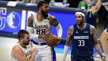 Apr 24, 2021; Dallas, Texas, USA; Los Angeles Lakers forward Markieff Morris (88) grabs a rebound in front of Dallas Mavericks center Willie Cauley-Stein (33) during the second quarter at the American Airlines Center. Mandatory Credit: Jerome Miron-Imagn Images