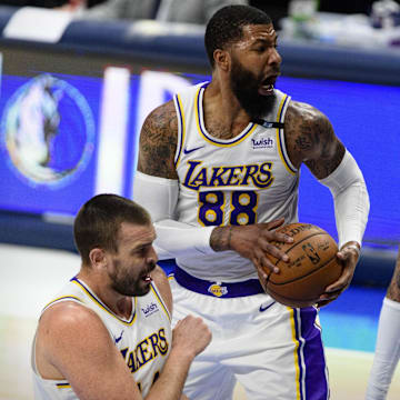 Apr 24, 2021; Dallas, Texas, USA; Los Angeles Lakers forward Markieff Morris (88) grabs a rebound in front of Dallas Mavericks center Willie Cauley-Stein (33) during the second quarter at the American Airlines Center. Mandatory Credit: Jerome Miron-Imagn Images