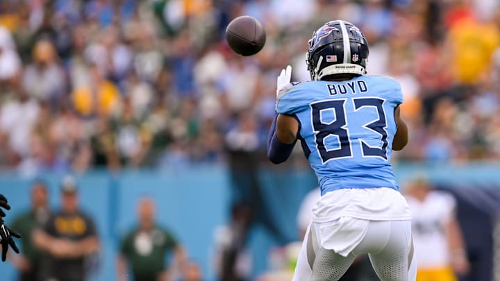 Sep 22, 2024; Nashville, Tennessee, USA;  Tennessee Titans wide receiver Tyler Boyd (83) makes a catch against the Green Bay Packers during the first half at Nissan Stadium. Mandatory Credit: Steve Roberts-Imagn Images