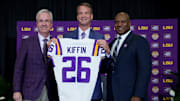 Dec 1, 2025; Baton Rouge, LA, USA; LSU president Wade Rousse, left, LSU new head coach Lane Kiffin and LSU athletic director Verge Ausberry stand together at South Stadium Club at Tiger Stadium. Mandatory Credit: Matthew Hinton-Imagn Images