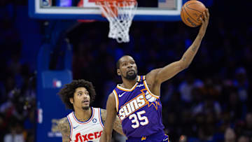 Jan 6, 2025; Philadelphia, Pennsylvania, USA; Phoenix Suns forward Kevin Durant (35) controls the ball in front of Philadelphia 76ers guard Kelly Oubre Jr. (9) during the second quarter at Wells Fargo Center. Mandatory Credit: Bill Streicher-Imagn Images