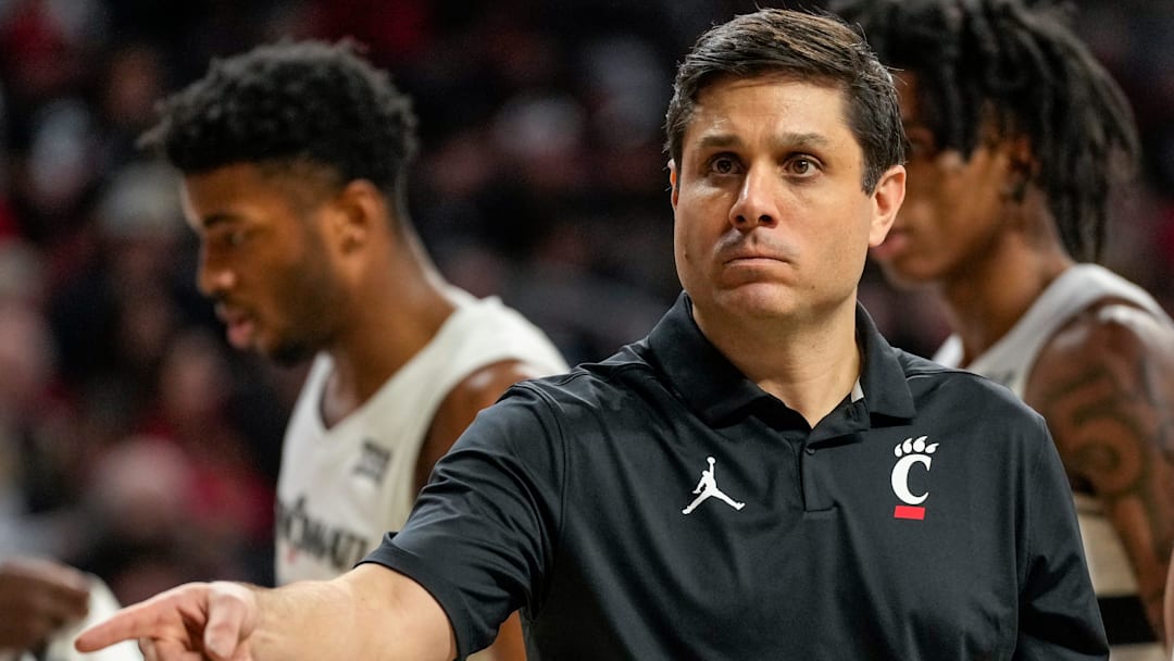 Cincinnati Bearcats head coach Wes Miller checks a spot in the second half of the NCAA basketball game between the Cincinnati Bearcats and the West Virginia Mountaineers at Fifth Third Arena in Cincinnati on Sunday, Feb. 2, 2025. The Bearcats lost, 63-50.