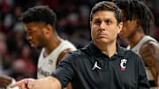 Cincinnati Bearcats head coach Wes Miller checks a spot in the second half of the NCAA basketball game between the Cincinnati Bearcats and the West Virginia Mountaineers at Fifth Third Arena in Cincinnati on Sunday, Feb. 2, 2025. The Bearcats lost, 63-50.
