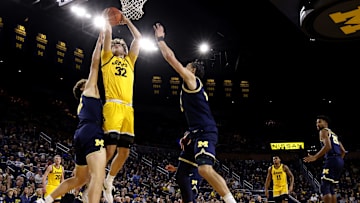 Jan 27, 2024; Ann Arbor, Michigan, USA; Iowa Hawkeyes forward Owen Freeman (32) is defended by