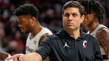 Cincinnati Bearcats head coach Wes Miller checks a spot in the second half of the NCAA basketball game between the Cincinnati Bearcats and the West Virginia Mountaineers at Fifth Third Arena in Cincinnati on Sunday, Feb. 2, 2025. The Bearcats lost, 63-50.