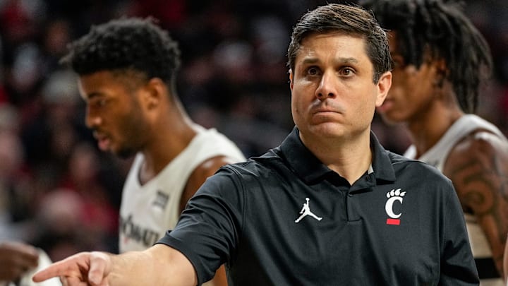 Cincinnati Bearcats head coach Wes Miller checks a spot in the second half of the NCAA basketball game between the Cincinnati Bearcats and the West Virginia Mountaineers at Fifth Third Arena in Cincinnati on Sunday, Feb. 2, 2025. The Bearcats lost, 63-50.