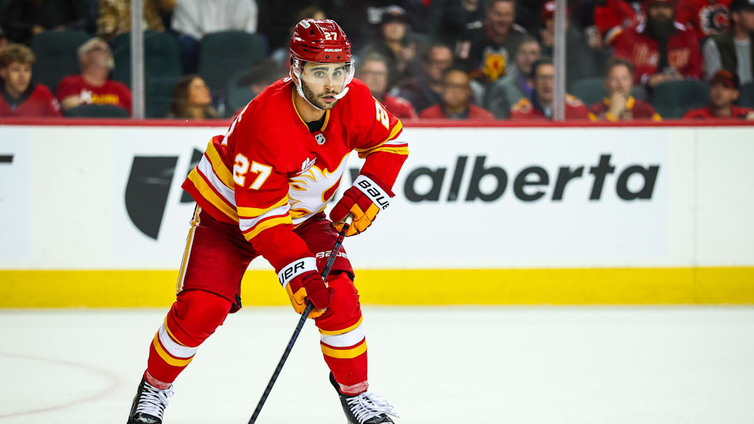 Mar 20, 2026; Calgary, Alberta, CAN; Calgary Flames right wing Matt Coronato (27) controls the puck against the Florida Panthers during the third period at Scotiabank Saddledome. Mandatory Credit: Sergei Belski-Imagn Images