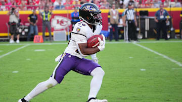 Sep 28, 2025; Kansas City, Missouri, USA; Baltimore Ravens running back Rasheen Ali (26) runs with the ball during the fourth quarter against the Kansas City Chiefs at GEHA Field at Arrowhead Stadium. Mandatory Credit: Denny Medley-Imagn Images