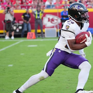 Sep 28, 2025; Kansas City, Missouri, USA; Baltimore Ravens running back Rasheen Ali (26) runs with the ball during the fourth quarter against the Kansas City Chiefs at GEHA Field at Arrowhead Stadium. Mandatory Credit: Denny Medley-Imagn Images