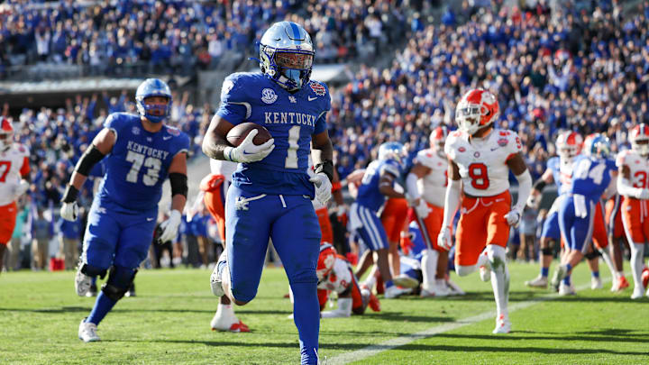 Dec 29, 2023; Jacksonville, FL, USA;  Kentucky Wildcats running back Ray Davis (1) runs into the end