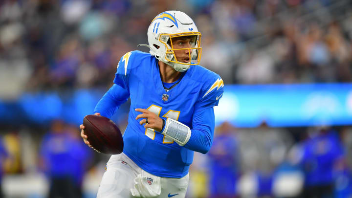 Aug 17, 2024; Inglewood, California, USA; Los Angeles Chargers quarterback Luis Perez (11) runs the ball against the Los Angeles Rams during the second half at SoFi Stadium. Mandatory Credit: Gary A. Vasquez-USA TODAY Sports