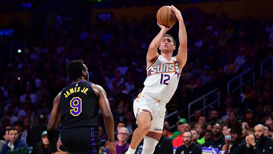 Phoenix Suns guard Collin Gillespie shoots against Los Angeles Lakers guard Bronny James.