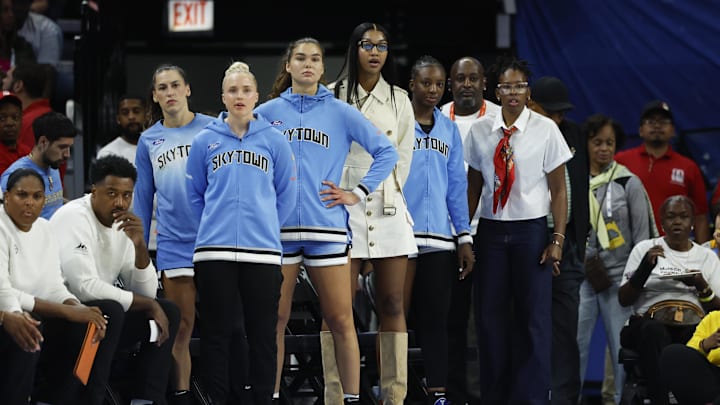 Aug 1, 2025; Chicago, Illinois, USA; Injured Chicago Sky forward Angel Reese (C) looks on from the bench during the first half of a WNBA game against the Golden State Valkyries at Wintrust Arena. Mandatory Credit: Kamil Krzaczynski-Imagn Images