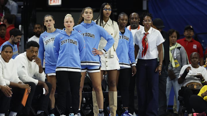 Aug 1, 2025; Chicago, Illinois, USA; Injured Chicago Sky forward Angel Reese (C) looks on from the bench during the first half of a WNBA game against the Golden State Valkyries at Wintrust Arena. Mandatory Credit: Kamil Krzaczynski-Imagn Images