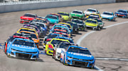 May 11, 2025; Kansas City, Kansas, USA; NASCAR Cup Series drivers Kyle Larson (5) and Chase Elliott (9) lead the field during a restart at the AdventHealth 400 at Kansas Speedway.