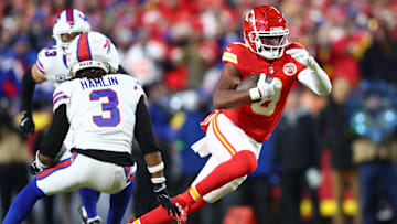 Jan 26, 2025; Kansas City, MO, USA; Kansas City Chiefs wide receiver JuJu Smith-Schuster (9) makes a catch against Buffalo Bills safety Damar Hamlin (3) during the first quarter in the AFC Championship game at GEHA Field at Arrowhead Stadium. Mandatory Credit: Mark J. Rebilas-Imagn Images