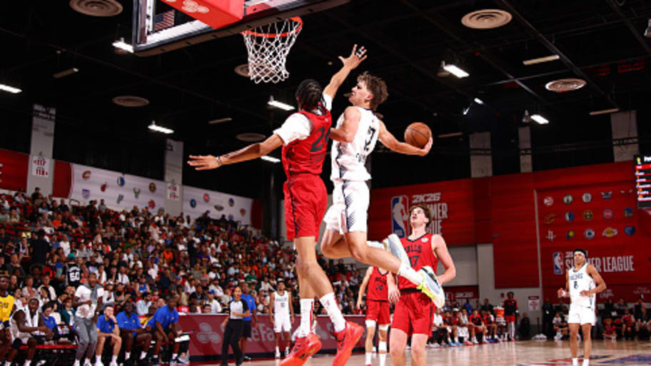 Johnny Furphy and Noa Essengue met at the rim. | Photo by Zach Beeker / NBAE via Getty Images
