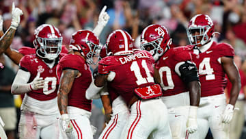 Sep 28, 2024; Tuscaloosa, Alabama, USA;  Members of the Alabama Crimson Tide defensive celebrate after a pass interception by defensive back Zabien Brown (2) to seal a victory over the Georgia Bulldogs during the fourth quarter at Bryant-Denny Stadium. Mandatory Credit: John David Mercer-Imagn Images