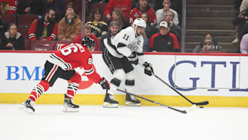 Mar 20, 2025; Chicago, Illinois, USA; Chicago Blackhawks center Teuvo Teravainen (86) and Los Angeles Kings center Anze Kopitar (11) battle for control of the puck during the first period at United Center. Mandatory Credit: Talia Sprague-Imagn Images