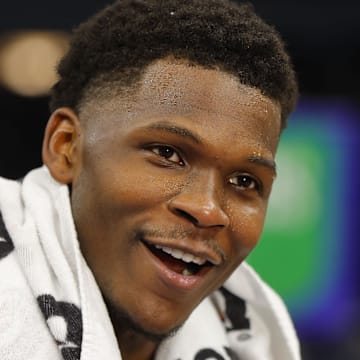 Dec 30, 2023; Minneapolis, Minnesota, USA; Minnesota Timberwolves guard Anthony Edwards (5) smiles as he gives an interview after defeating the Los Angeles Lakers at Target Center. Mandatory Credit: Bruce Kluckhohn-Imagn Images