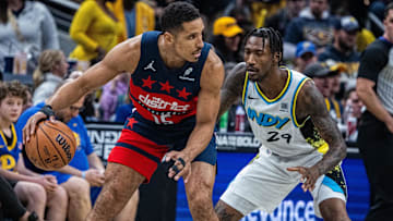 Nov 24, 2024; Indianapolis, Indiana, USA; Washington Wizards guard Malcolm Brogdon (15) dribbles the ball while   Indiana Pacers guard Quenton Jackson (29) defends in the first quarter at Gainbridge Fieldhouse. Mandatory Credit: Trevor Ruszkowski-Imagn Images