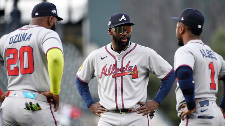 Apr 29, 2025; Denver, Colorado, USA; Atlanta Braves outfielder Michael Harris II (23) talks with designated hitter Marcell Ozuna (20) and second base Ozzie Albies (1) before the game against the Colorado Rockies at Coors Field. Mandatory Credit: Christopher Hanewinckel-Imagn Images